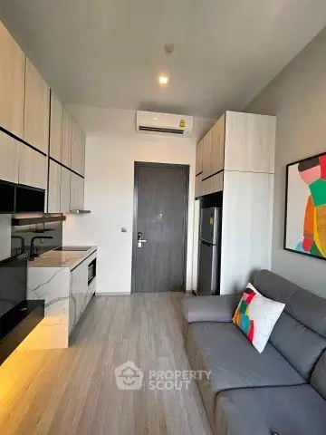 Modern compact living room with sleek kitchen and stylish decor