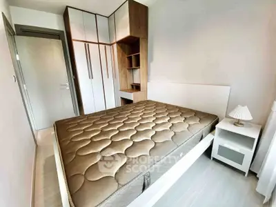 Modern bedroom with stylish wardrobe and cozy bed in a bright apartment.