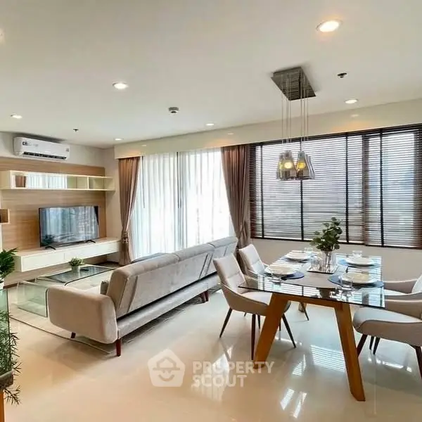 Modern living room with elegant dining area and natural light
