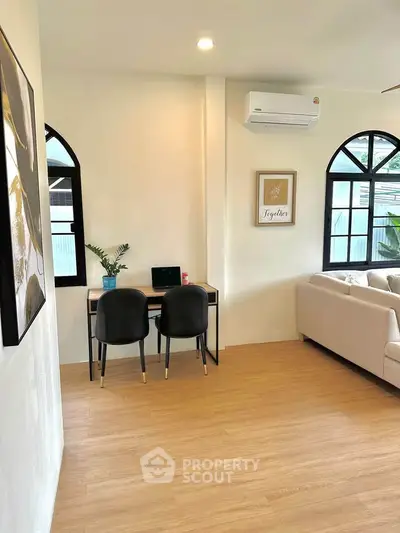 Modern living room with cozy study nook and elegant decor