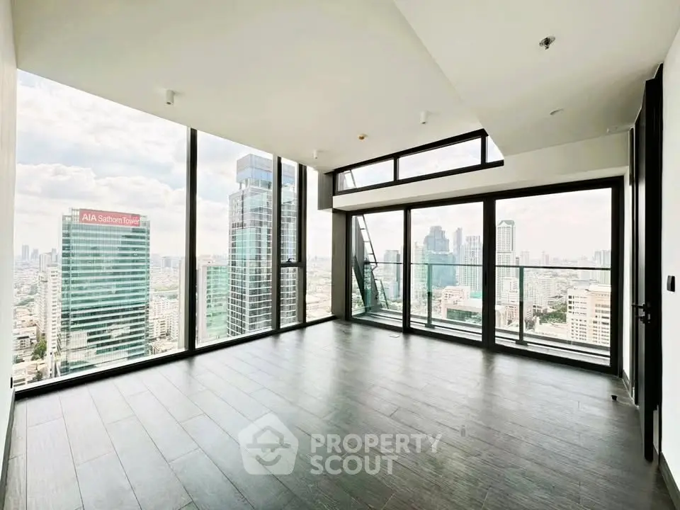 Stunning corner unit with panoramic city views and floor-to-ceiling windows in a modern high-rise.