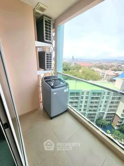 High-rise balcony with washing machine and stunning city view
