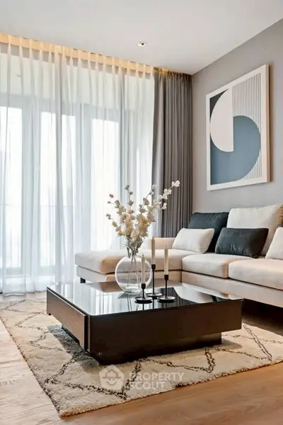 Elegant living room with modern decor, large windows, and stylish furniture, perfect for relaxation and entertaining.