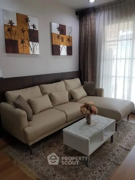 Elegant living room with cozy beige sofa and chic decor