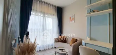 Cozy living room with elegant decor and large window view