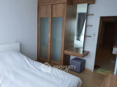 Modern bedroom with wooden wardrobe and stylish decor