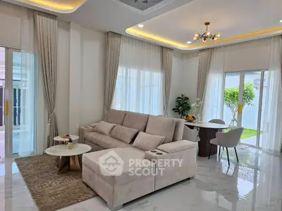Luxurious modern living room with elegant decor and garden view