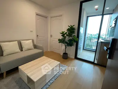 Modern living room with balcony view and stylish furniture