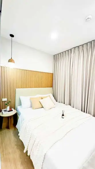 Cozy modern bedroom with elegant decor and soft lighting