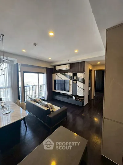 Modern living room with sleek design, open layout, and balcony view in luxury apartment.