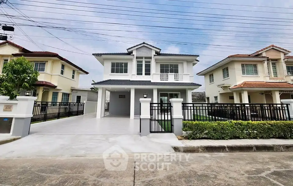 Stunning two-story modern house with spacious driveway and elegant facade in a serene neighborhood.