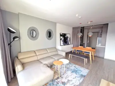 Modern living room with stylish decor and open dining area