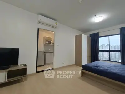 Modern studio apartment with kitchenette and city view