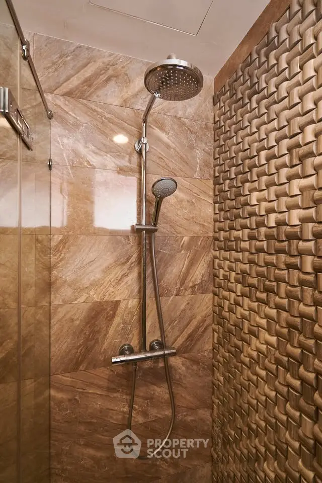 Luxurious bathroom with modern shower and textured wall design