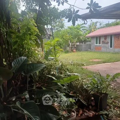 Charming rural property with lush garden and cozy house, perfect for nature lovers seeking tranquility.