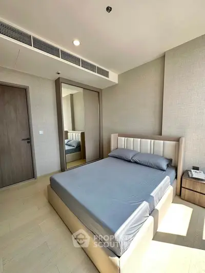 Modern bedroom with sleek design and ample natural light