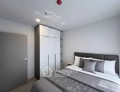 Modern bedroom with sleek design and ample storage space