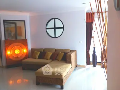 Stylish living room with modern decor and cozy sectional sofa, perfect for relaxation and entertaining.