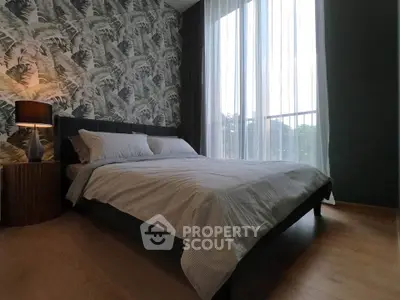 Stylish bedroom with floor-to-ceiling windows and modern decor