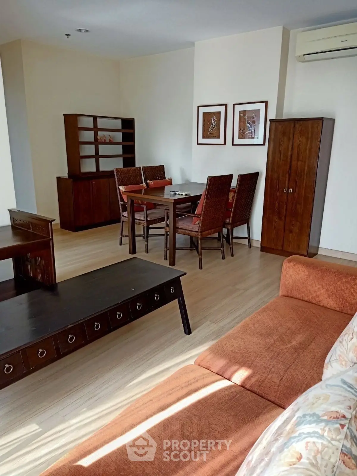 Spacious living room with elegant dining area and cozy sofa