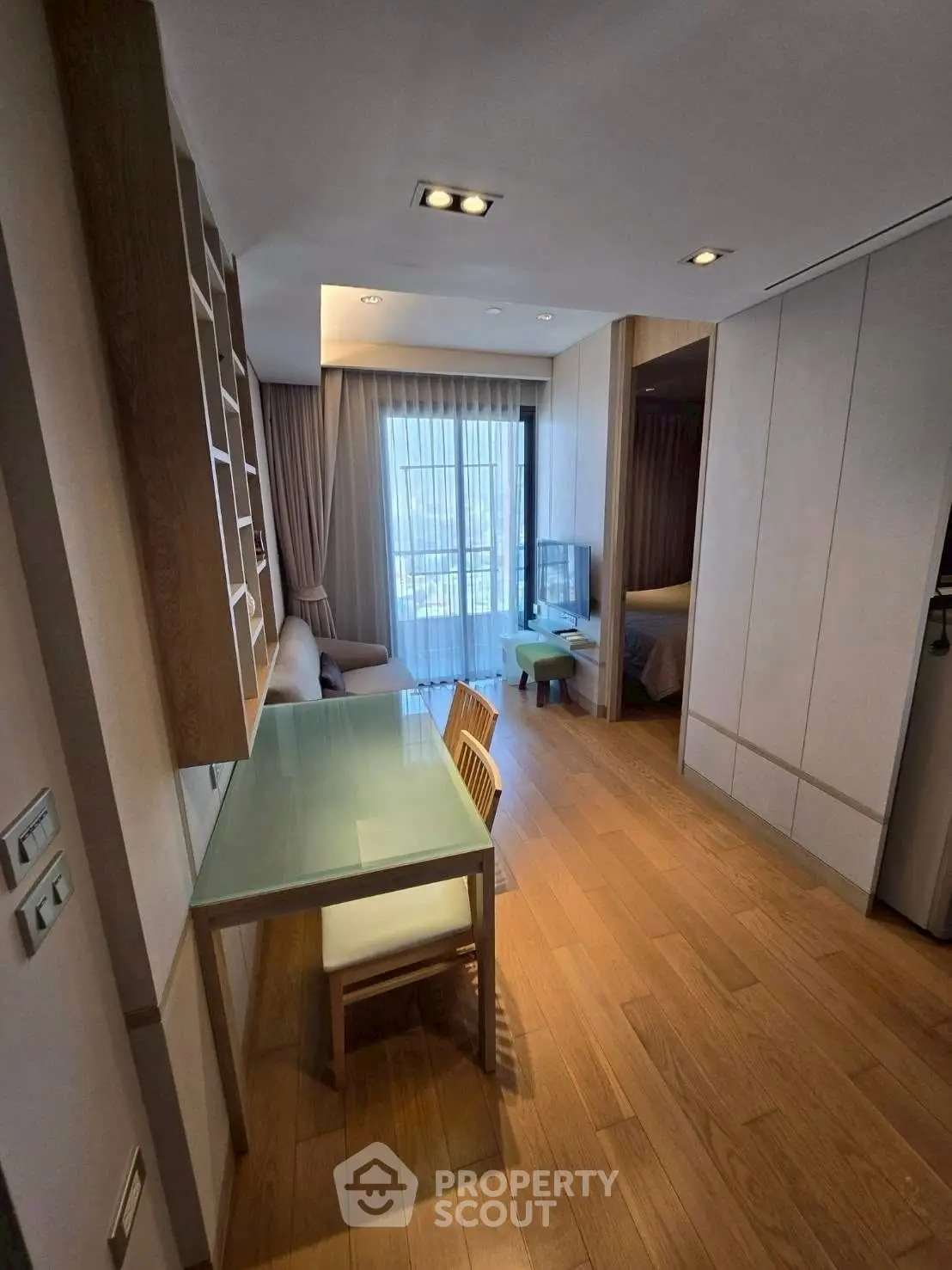 Modern apartment interior with wooden flooring and stylish furniture