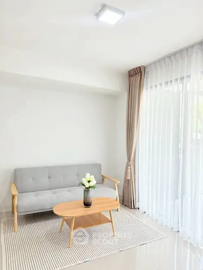 Bright and modern living room with cozy sofa and elegant decor