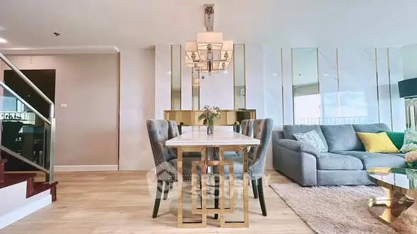 Luxurious modern living room with elegant dining area and plush seating.