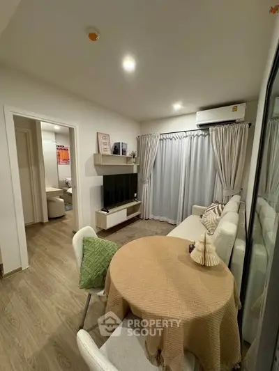 Modern living room with cozy decor and natural light