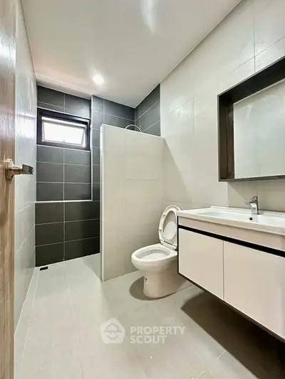 Modern bathroom with sleek design and spacious shower area.