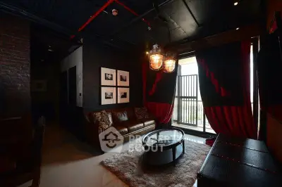 Stylish living room with industrial decor and large windows in modern apartment.