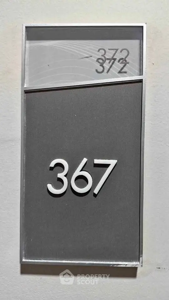 Modern apartment door number 367 with sleek design