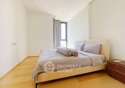 Spacious and bright bedroom with modern decor and large window