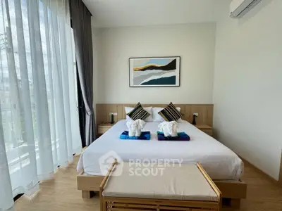 Modern bedroom with large windows and stylish decor in a luxury apartment
