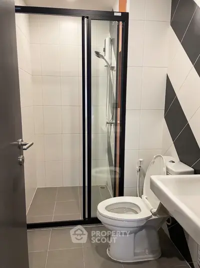 Modern bathroom with sleek shower and stylish tiles