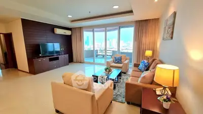 Spacious living room with modern decor and city view balcony