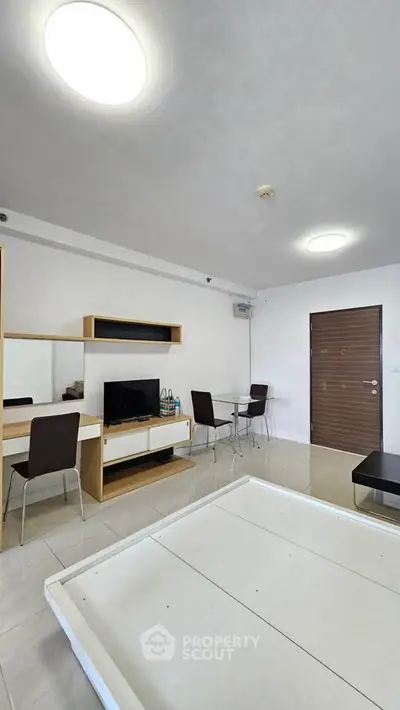 Modern living room with sleek furniture and minimalist design, perfect for urban living.