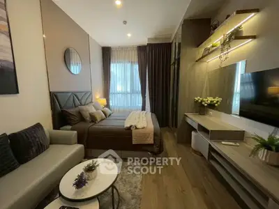 Modern bedroom with stylish decor and cozy ambiance, featuring a comfortable bed and elegant furnishings.