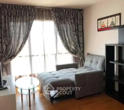 Cozy living room with stylish sofa bed and elegant curtains