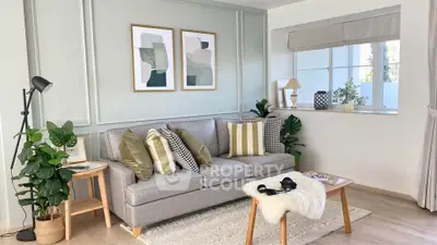 Stylish modern living room with cozy gray sofa and chic decor