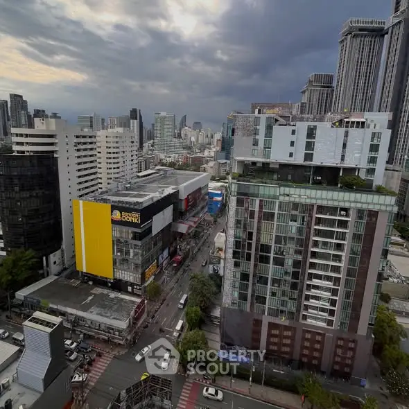 Stunning cityscape view showcasing modern high-rise buildings under a dramatic cloudy sky.