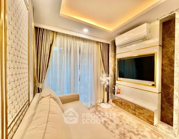 Luxurious living room with elegant decor, plush sofa, and modern entertainment setup.