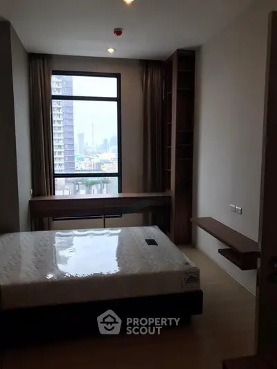 Modern bedroom with city view and stylish furniture in high-rise apartment