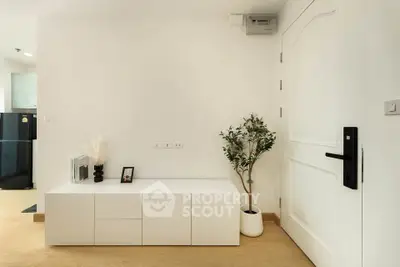 Modern minimalist interior with white furniture and wooden flooring