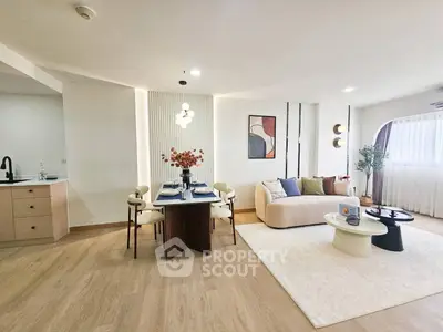 Spacious modern living room with elegant dining area and stylish decor