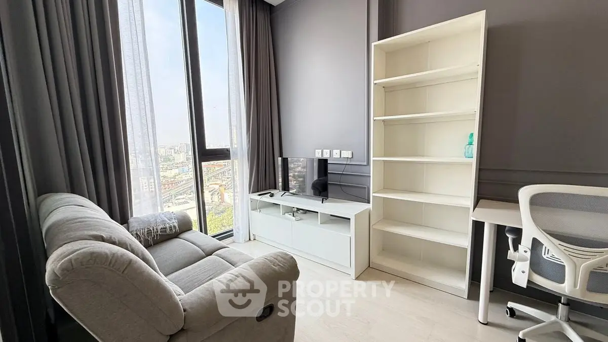 Modern living room with large window, cozy sofa, and stylish furniture in a high-rise apartment.