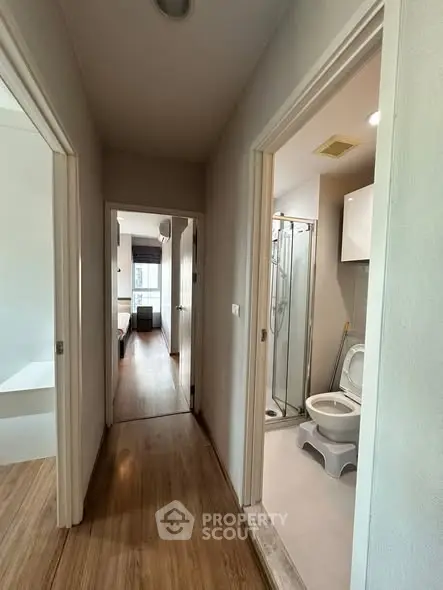 Modern apartment hallway with bathroom and bedroom view