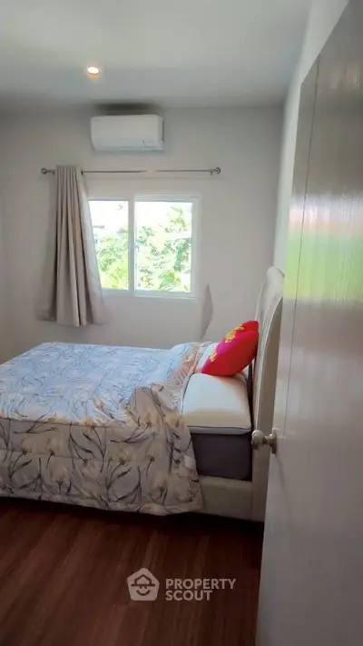 Cozy bedroom with natural light and modern decor