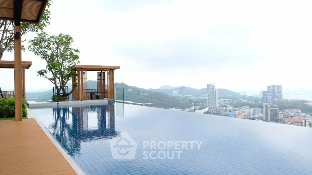 Luxurious rooftop infinity pool with stunning city and mountain views.