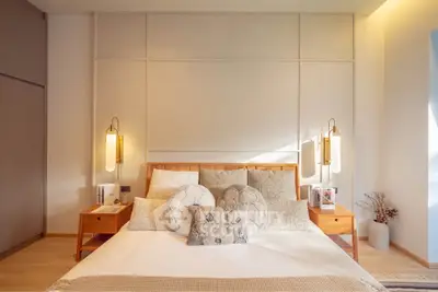 Elegant bedroom with modern decor and warm lighting