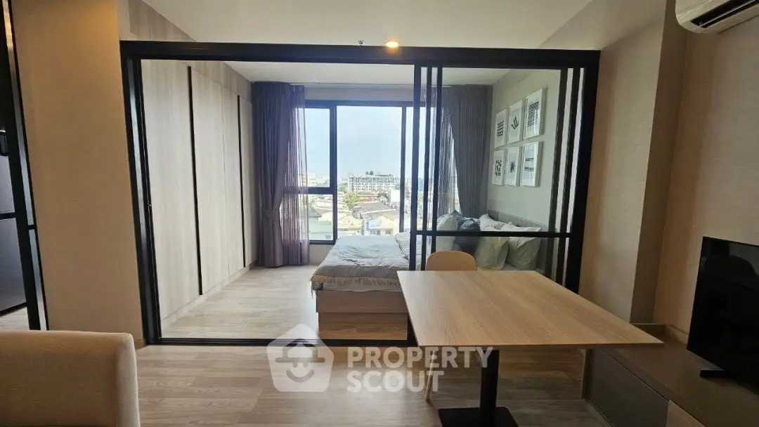 Modern apartment with sliding glass doors and city view